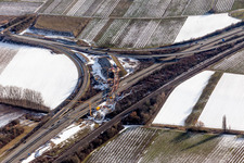 Wintry snowy Routing and traffic lanes over the highway bridge in the motorway A 65 in Landau in der Pfalz in the state Rhineland-Palatinate, Germany