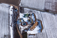 Oblique view of Wintry snowy Construction site for wind turbine installation in Hatzenbuehl in the state Rhineland-Palatinate, Germany