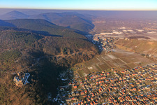 Village overview on the edge of the Haardt with Landeck Castle in winter with little snow from the south in Klingenmünster in the state Rhineland-Palatinate, Germany