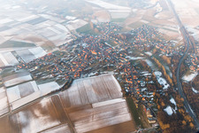 Wintry snowy Village - view on the edge of agricultural fields and farmland in Riedseltz in Grand Est, France