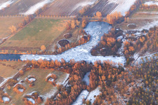 Frozen swan pond and tank ditch at Viehstrich in winter with little snow from the southwest in Steinfeld in the state Rhineland-Palatinate, Germany