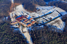 Oblique view of Horse boarding at Liebfrauenberg Monastery in winter with snow in Bad Bergzabern in the state Rhineland-Palatinate, Germany