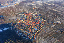 Village overview on the edge of the Haardt in winter with little snow from the south in Eschbach in the state Rhineland-Palatinate, Germany