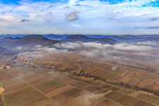 Aerial view of Village view on the edge of the Haardt in winter with low clouds from the east in Leinsweiler in the state Rhineland-Palatinate, Germany
