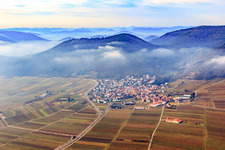 Village view on the edge of the Haardt in winter with low clouds from the east in Eschbach in the state Rhineland-Palatinate, Germany