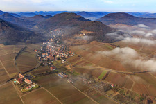 Aerial photograpy of Village view on the edge of the Haardt in winter with low clouds from the east in Leinsweiler in the state Rhineland-Palatinate, Germany
