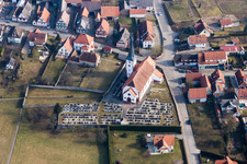 Grave rows on the grounds of the cemetery on the churh catholic Saint-Martin in Seebach in Grand Est, France