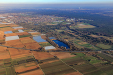 City view and Mußbacher Baggerweiher beyond the A65 in Haßloch in the state Rhineland-Palatinate, Germany