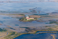 Aerial view of Coastal area of the Adria - Island and monastery of Santuario Di Barbana in Grado in Friuli-Venezia Giulia, Italy