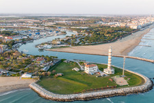 Aerial view of Light House Faro di Piave Vecchiaas a historic seafaring character in the coastal area of Adria in Lido di Jesolo in Venetien, Italy