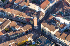 Tower building Torre Civica between ancient roads in the historic city centre of Comacchio in Emilia-Romagna, Italy