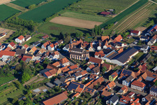 Main street with St. Laurentius Church Schweighofen and Stefan Fischer Winery in Schweighofen in the state Rhineland-Palatinate, Germany