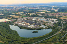 Overview of the Industriepark Wörth GmbH from the northwest across the lake Kiefer Rathjen with Mercedes-Benz Trucks in Wörth am Rhein in the state Rhineland-Palatinate, Germany
