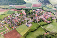 Village - view on the edge of agricultural fields and farmland in Untersteinbach in the state Bavaria, Germany