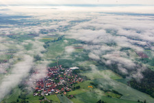 Aerial view of Village under clouds in the district Ampferbach in Burgebrach in the state Bavaria, Germany