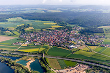 Village - view on the edge of agricultural fields and farmland in Stettfeld in the state Bavaria, Germany