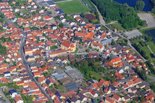 Village center with St. Nicholas Church Sand am Main and greenhouses of Blumen Zösch in Sand am Main in the state Bavaria, Germany