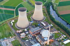 Oblique view of Cooling towers and reactor dome of the nuclear power plant Grafenrheinfeld of Preussenelektra GmbH at sunset in Grafenrheinfeld in the state Bavaria, Germany