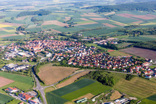 Village - view on the edge of agricultural fields and farmland in Stadtlauringen in the state Bavaria, Germany