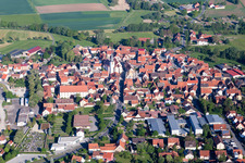 Aerial view of Village - view on the edge of agricultural fields and farmland in Stadtlauringen in the state Bavaria, Germany