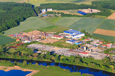 Industrial estate on the banks of the Main with WEMAS Baseplates GmbH, Sägewerk Reitz GmbH and Betonwerk GODELMANN GmbH & Co. KG in Wonfurt in the state Bavaria, Germany