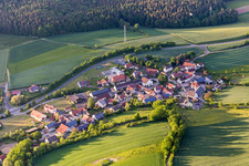 Village - view on the edge of agricultural fields and farmland in Salmsdorf in the state Bavaria, Germany