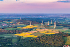 Wind farm in the evening light in the district Marktsteinach in Schonungen in the state Bavaria, Germany