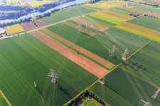 Aerial photograpy of Cooling towers and high-voltage lines to the nuclear power plant Grafenrheinfeld of Preussenelektra GmbH on the Main river bank from the west in Grafenrheinfeld in the state Bavaria, Germany