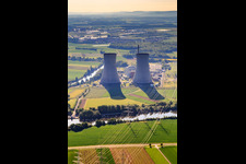 Cooling towers and high-voltage lines to the nuclear power plant Grafenrheinfeld of Preussenelektra GmbH on the Main river bank from the west in Grafenrheinfeld in the state Bavaria, Germany from above
