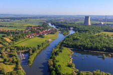 Harbor in front of and cooling tower of the Grafenrheinfeld nuclear power plant behind the village on the banks of the Main from the south in the district Garstadt in Bergrheinfeld in the state Bavaria, Germany