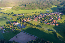 Pond with island on the outskirts in the district Rehweiler in Geiselwind in the state Bavaria, Germany
