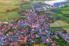 Aerial view of Church of St. John the Baptist Donnersdorf in the village center in Donnersdorf in the state Bavaria, Germany
