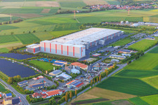 Aerial view of Industrial estate Am Rödertor with DLZ Donnersdorf- central warehouse and Kaufland Logistik VZ GmbH & Co. KG and Baumann Recycling GmbH in Donnersdorf in the state Bavaria, Germany