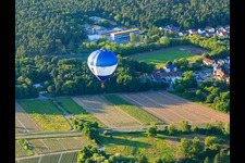 Hot air balloon over the sports field Dudenhofen in Dudenhofen in the state Rhineland-Palatinate, Germany