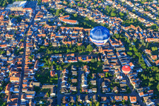 Two hot air balloons over Eichgartenstr in Dudenhofen in the state Rhineland-Palatinate, Germany