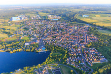 City view from the north in the evening behind the Freyersee in Philippsburg in the state Baden-Wuerttemberg, Germany