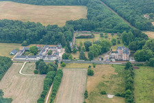 Aerial view of Building and castle park systems of water castle Chateau de Combreux in Combreux in Centre-Val de Loire, France