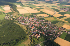 Aerial view of Village - view on the edge of agricultural fields and farmland in Moenchsdeggingen in the state Bavaria, Germany