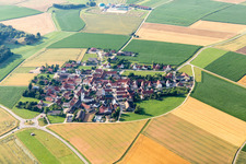 Aerial view of Village - view on the edge of agricultural fields and farmland in Moenchsdeggingen in the state Bavaria, Germany