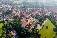 Oblique view of Complex of buildings of the monastery Heilig Kreuz in front of Ried island in Donauwoerth in the state Bavaria, Germany