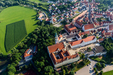 Complex of buildings of the monastery Heilig Kreuz in front of Ried island in Donauwoerth in the state Bavaria, Germany from above