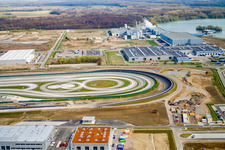 Oblique view of Oberwald Industrial Estate: Daimler Truck Testing Site in Wörth am Rhein in the state Rhineland-Palatinate, Germany