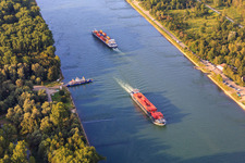 Rhine ferry Leimersheim is waiting for 2 cargo ships on the Rhine in Leimersheim in the state Rhineland-Palatinate, Germany