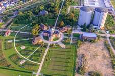 Aerial photograpy of Two large silos of former Südzucker at the Eremitage Waghäuse in the evening light in Waghäusel in the state Baden-Wuerttemberg, Germany