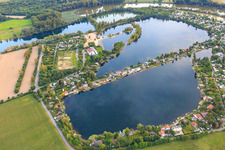 Blue Adriatic recreation area with swan pond and Adriatic weir in Altrip in the state Rhineland-Palatinate, Germany