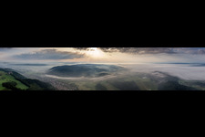 The Lake of Constance hidden by morning fog over Village - view on the edge of agricultural fields and farmland in the district Stahringen in Radolfzell am Bodensee in the state Baden-Wurttemberg, Germany