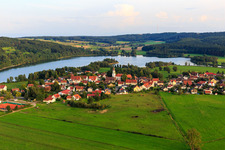 Aerial photograpy of Village view on Illmensee from the northeast with Catholic Church of the Assumption in Illmensee in the state Baden-Wuerttemberg, Germany