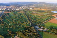 Oblique view of Railway line cuts through the golf course of Golf-Club Bensheim eV in Bensheim in the state Hesse, Germany