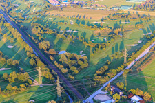 Railway line cuts through the golf course of Golf-Club Bensheim eV in Bensheim in the state Hesse, Germany out of the air