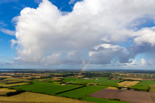 Rainbow under cumulus in Janderup in the state South Denmark, Denmark